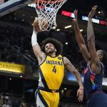 
              Indiana Pacers' Duane Washington Jr. is defended by Philadelphia 76ers' DeAndre Jordan while going up for a dunk during the second half of an NBA basketball game Tuesday, April 5, 2022, in Indianapolis. Jordan was called for a foul (AP Photo/Darron Cummings)
            