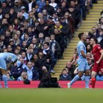 
              Liverpool's Diogo Jota, right, celebrates after scoring his side's opening goal during the English Premier League soccer match between Manchester City and Liverpool, at the Etihad stadium in Manchester, England, Sunday, April 10, 2022. (AP Photo/Jon Super)
            