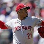 
              Cincinnati Reds starting pitcher Hunter Greene (21) delivers in the first inning of a baseball game against the Atlanta Braves, Sunday, April 10, 2022, in Atlanta. (AP Photo/John Bazemore)
            