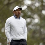 
              Tiger Woods walks to the fourth green after his tee shot during the third round at Augusta National Golf Club on Saturday, April 9, 2022, in Augusta, Ga. (Jason Getz/Atlanta Journal-Constitution via AP)
            