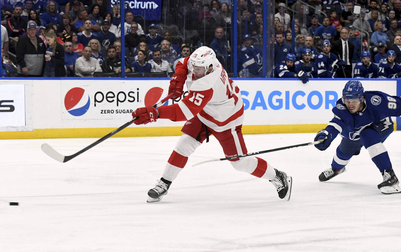 Detroit Red Wings left wing Jakub Vrana (15) scores during the third period an NHL hockey game agai...