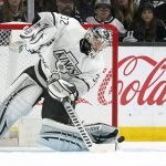 
              Los Angeles Kings goaltender Jonathan Quick allows the puck in for a goal as he tries to pass it during the second period of an NHL hockey game against the Anaheim Ducks Saturday, April 23, 2022, in Los Angeles. (AP Photo/Mark J. Terrill)
            