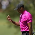 
              Tiger Woods waves after his shot on the seventh hole during the first round at the Masters golf tournament on Thursday, April 7, 2022, in Augusta, Ga. (AP Photo/David J. Phillip)
            