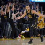 
              Golden State Warriors guard Stephen Curry (30) celebrates after hitting a 3-point basket against the Denver Nuggets during the first half of Game 1 of an NBA basketball first-round playoff series in San Francisco, Saturday, April 16, 2022. (AP Photo/Jeff Chiu)
            