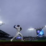 
              Kansas City Royals' Nicky Lopez warms up in the mist before a baseball game against the Minnesota Twins Wednesday, April 20, 2022, in Kansas City, Mo. (AP Photo/Charlie Riedel)
            