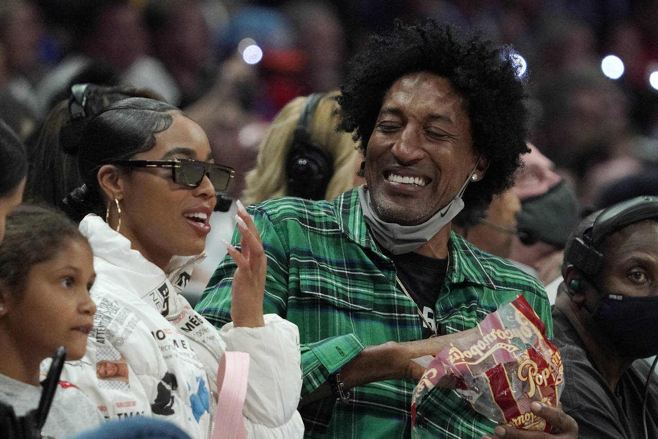 Former basketball player Scottie Pippen watches during the second half of an NBA basketball game be...