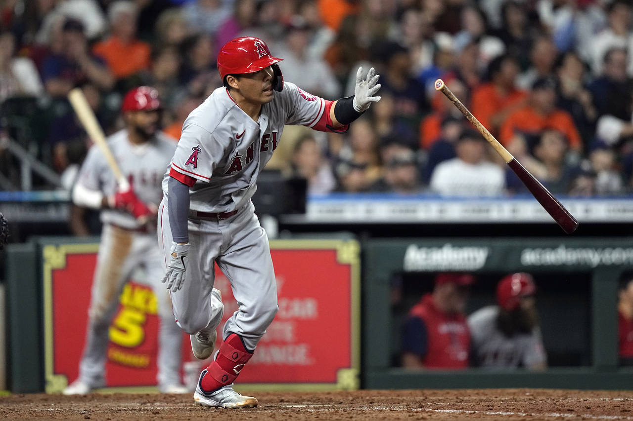 Los Angeles Angels' Kurt Suzuki tosses his bat after hitting a two-run double during the fifth inni...