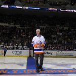 
              FILE - Hockey Hall of Famer and former New York Islander Mike Bossy is introduced to the fans before he drops a ceremonial first puck during a tribute to Bossy before an NHL hockey game between the New York Islanders and Boston Bruins at Nassau Coliseum on Thursday, Jan. 29, 2015, in Uniondale, N.Y. Bossy, one of hockey’s most prolific goal-scorers and a star for the New York Islanders during their 1980s dynasty, died Thursday, April 14, 2022, after a battle with lung cancer. He was 65. (AP Photo/Kathy Kmonicek, File)
            