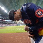 
              Houston Astros' Jeremy Pena bend down after being doused with water by teammates after hitting a game-winning two-run home run against the Toronto Blue Jays in the 10th inning of a baseball game Sunday, April 24, 2022, in Houston. The Astros won 8-7 in 10 innings. (AP Photo/David J. Phillip)
            