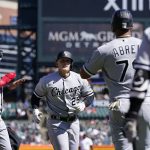
              Chicago White Sox designated hitter Andrew Vaughn (25) is greeted by Eloy Jimenez, left, and Jose Abreu after they scored on Vaughn's three-run home run during the seventh inning of a baseball game against the Detroit Tigers, Sunday, April 10, 2022, in Detroit. (AP Photo/Carlos Osorio)
            