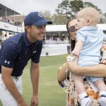 
              Jordan Spieth, left, greets his wife, Annie Spieth, and baby Samual on the 18th green after winning a one-hole playoff in the final round of the RBC Heritage golf tournament, Sunday, April 17, 2022, in Hilton Head Island, S.C. (AP Photo/Stephen B. Morton)
            