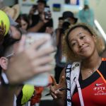 
              Naomi Osaka of Japan poses for selfies with fans after winning her women's semifinal match against Belinda Bencic of Switzerland, at the Miami Open tennis tournament, Thursday, March 31, 2022, in Miami Gardens, Fla. (AP Photo/Rebecca Blackwell)
            