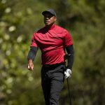 
              Tiger Woods walks down the fifth fairway during the final round at the Masters golf tournament on Sunday, April 10, 2022, in Augusta, Ga. (AP Photo/Jae C. Hong)
            