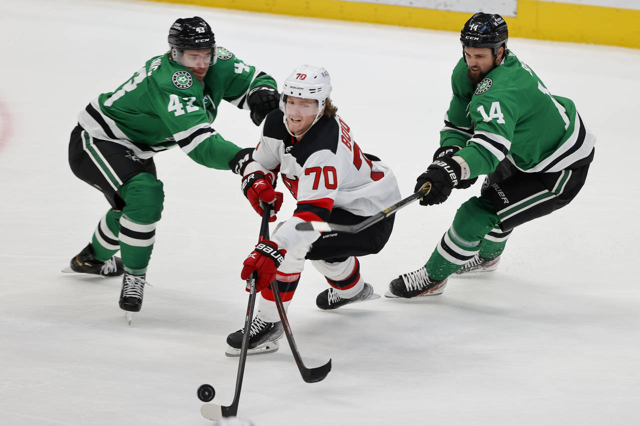 Dallas Stars left wing Marian Studenic (43) and left wing Jamie Benn (14) defend against New Jersey...