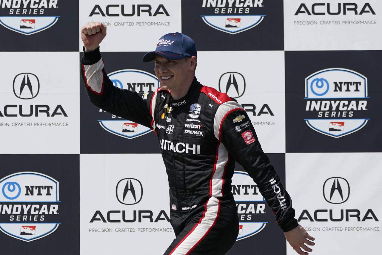 Team Penske driver Josef Newgarden (2) of United States celebrates after winning an IndyCar auto ra...
