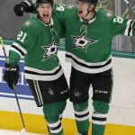 
              Dallas Stars center Roope Hintz (24) celebrates his goal with left wing Jason Robertson (21) during the third period of the team's NHL hockey game against the Tampa Bay Lightning in Dallas, Tuesday, April 12, 2022. The Stars won 1-0. (AP Photo/LM Otero)
            