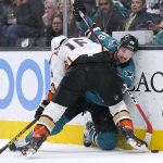 
              San Jose Sharks center Tomas Hertl (48) is checked into the boards by Anaheim Ducks center Zach Aston-Reese (16) during the first period in an NHL hockey game Tuesday, April 26, 2022, in San Jose, Calif. (AP Photo/Tony Avelar)
            