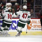 
              Minnesota Wild players celebrate a goal against the Carolina Hurricanes during the second period of an NHL hockey game in Raleigh, N.C., Saturday, April 2, 2022. (AP Photo/Karl B DeBlaker)
            