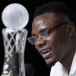 
              Oscar Tshiebwe of Kentucky speaks as he is introduced as The Associated Press men's basketball player of the year, in New Orleans, Friday, April 1, 2022. The 6-foot-9, 255-pound junior received 46 of 60 votes from a national media panel. Wisconsin's Johnny Davis was second with 10 votes. (AP Photo/Gerald Herbert)
            