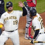 
              Pittsburgh Pirates' Daniel Vogelbach (19) is greeted by teammate Ben Gamel (18) after scoring on a sacrifice fly by Yoshi Tsutsugo off Washington Nationals relief pitcher Andres Machado during the sixth inning of a baseball game in Pittsburgh, Thursday, April 14, 2022. (AP Photo/Gene J. Puskar)
            