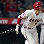 
              Los Angeles Angels' Shohei Ohtani breaks his bat as he singles during the eighth inning against the Cleveland Guardians in a baseball game Wednesday, April 27, 2022, in Anaheim, Calif. (AP Photo/Marcio Jose Sanchez)
            