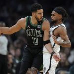 
              Boston Celtics forward Jayson Tatum (0) looks for an opening around Brooklyn Nets guard Patty Mills (8) in the second half of Game 1 of an NBA basketball first-round Eastern Conference playoff series, Sunday, April 17, 2022, in Boston. The Celtics won 115-114. (AP Photo/Steven Senne)
            