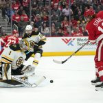 
              Boston Bruins goaltender Jeremy Swayman (1) stops a Detroit Red Wings defenseman Marc Staal (18) shot in the second period of an NHL hockey game Tuesday, April 5, 2022, in Detroit. (AP Photo/Paul Sancya)
            