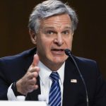 
              FILE - FBI Director Christopher Wray testifies during a Senate Judiciary hearing about the Inspector General's report on the FBI's handling of the Larry Nassar investigation on Capitol Hill, Wednesday, Sept. 15, 2021, in Washington.Thirteen sexual assault victims of Nassar are seeking $10 million each from the FBI, claiming a bungled investigation by agents led to more abuse by the sports doctor, lawyers said Thursday, April 21, 2022. (Graeme Jennings/Pool via AP File)
            