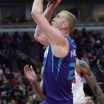
              Charlotte Hornets center Mason Plumlee goes up for a shot against Chicago Bulls forward DeMar DeRozan during the first half of an NBA basketball game in Chicago, Friday, April 8, 2022. (AP Photo/Nam Y. Huh)
            