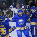 
              Buffalo Sabres center Vinnie Hinostroza (29), defenseman Henri Jokiharju (10) and left wing Anders Bjork (96) celebrate a goal by Hinostroza during the second period of an NHL hockey game against the New York Islanders on Saturday, April 23, 2022, in Buffalo, N.Y. (AP Photo/Joshua Bessex)
            