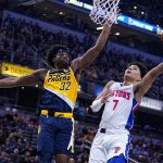 
              Detroit Pistons guard Killian Hayes (7) shoots over Indiana Pacers guard Terry Taylor (32) during the first half of an NBA basketball game in Indianapolis, Sunday, April 3, 2022. (AP Photo/Michael Conroy)
            