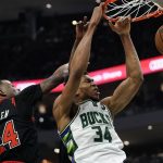 
              Milwaukee Bucks' Giannis Antetokounmpo dunks past Chicago Bulls' Javonte Green during the first half of Game 1 of their first round NBA playoff basketball game Sunday, April 17, 2022, in Milwaukee. (AP Photo/Morry Gash)
            