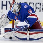 
              New York Rangers goaltender Alexandar Georgiev (40) makes a save during the second period of an NHL hockey game against the Washington Capitals, Friday, April 29, 2022, in New York. (AP Photo/John Minchillo)
            