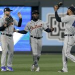 
              Detroit Tigers players outfielders Victor Reyes, right, Austin Meadows, left, and Akil Baddoo celebrate after their baseball game against the Kansas City Royals Friday, April 15, 2022, in Kansas City, Mo. The Tigers won 2-1. (AP Photo/Charlie Riedel)
            