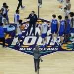 
              Duke head coach Mike Krzyzewski talks with his team after practice for the men's Final Four NCAA college basketball tournament, Friday, April 1, 2022, in New Orleans. (AP Photo/David J. Phillip)
            