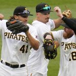 
              Pittsburgh Pirates outfielders Jake Marisnick (41), Bryan Reynolds, center, and Ben Gamel (18) celebrate after getting the final out of a 6-2 win over the Chicago Cubs in a baseball game in Pittsburgh, Wednesday, April 13, 2022. (AP Photo/Gene J. Puskar)
            
