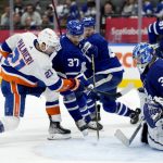 
              New York Islanders right wing Kyle Palmieri (21) takes a shot at Toronto Maple Leafs goaltender Jack Campbell (36) during the third period of an NHL hockey game in Toronto, Sunday, April 17, 2022. (Frank Gunn/The Canadian Press via AP)
            