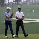 
              Tiger Woods, right, speaks with Justin Thomas on the 10th green during a practice round for the Masters golf tournament on Wednesday, April 6, 2022, in Augusta, Ga. (AP Photo/Robert F. Bukaty)
            