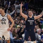 
              Dallas Mavericks guard Luka Doncic (77) celebrates behind Utah Jazz forward Bojan Bogdanovic (44) after scoring during the second half of Game 5 of an NBA basketball first-round playoff series, Monday, April 25, 2022, in Dallas. (AP Photo/Tony Gutierrez)
            