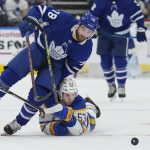 
              Toronto Maple Leafs defenseman TJ Brodie (78) drives past Buffalo Sabres forward Jeff Skinner (53) during the second period of an NHL hockey game Tuesday, April 12, 2022, in Toronto. (Nathan Denette/The Canadian Press via AP)
            
