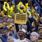 
              Fans cheer in the second half during Game 5 of a first-round NBA basketball playoff series between the Minnesota Timberwolves and the Memphis Grizzlies Tuesday, April 26, 2022, in Memphis, Tenn. (AP Photo/Brandon Dill)
            
