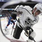 
              Los Angeles Kings center Anze Kopitar, front, collects the puck as Colorado Avalanche defenseman Cale Makar defends during the second period of an NHL hockey game Wednesday, April 13, 2022, in Denver. (AP Photo/David Zalubowski)
            