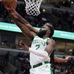 
              Boston Celtics guard Jaylen Brown (7) drives to the basket against Chicago Bulls guard Coby White during the second half of an NBA basketball game in Chicago, Wednesday, April 6, 2022. The Celtics won 117-94. (AP Photo/Nam Y. Huh)
            