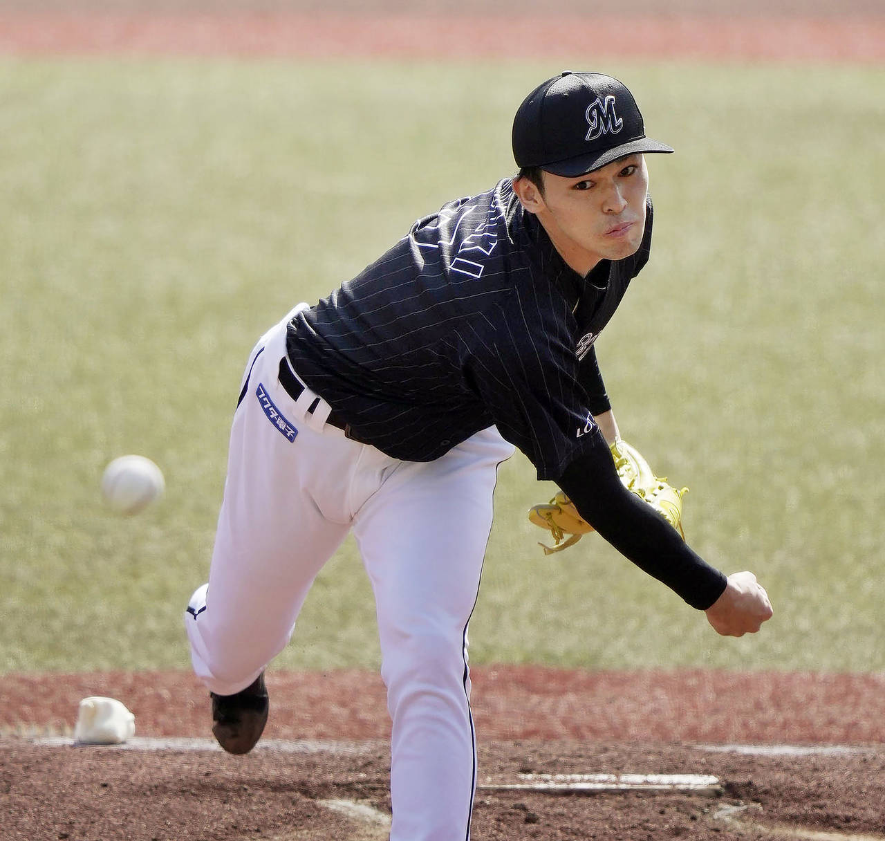 FILE - Chiba Lotte Marines Roki Sasaki pitches during a game against the Orix Buffaloes in Chiba, n...