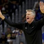 
              Golden State Warriors coach Steve Kerr gestures to the team during the first half of Game 5 of an NBA basketball first-round playoff series against the Denver Nuggets in San Francisco, Wednesday, April 27, 2022. (AP Photo/Jed Jacobsohn)
            