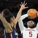
              Stanford's Francesca Belibi tries to shoot past UConn's Olivia Nelson-Ododa during the first half of a college basketball game in the semifinal round of the Women's Final Four NCAA tournament Friday, April 1, 2022, in Minneapolis. (AP Photo/Eric Gay)
            