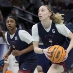 
              UConn's Paige Bueckers and Christyn Williams run a drill during a practice session for a college basketball game in the final round of the Women's Final Four NCAA tournament Saturday, April 2, 2022, in Minneapolis. (AP Photo/Charlie Neibergall)
            