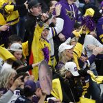 
              Minnesota State fans celebrate a goal by David Silye against Minnesota during the third period of an NCAA men's Frozen Four college hockey semifinal, Thursday, April 7, 2022, in Boston. (AP Photo/Michael Dwyer)
            