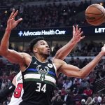 
              Milwaukee Bucks forward Giannis Antetokounmpo (34) battles for a rebound against Chicago Bulls center Nikola Vucevic during the first half of Game 3 of a first-round NBA basketball playoff series Friday, April 22, 2022, in Chicago. (AP Photo/Nam Y. Huh)
            