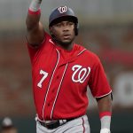 
              Washington Nationals' Maikel Franco gestures to the dugout after hitting a three-run double in the eighth inning of a baseball game against the Atlanta Braves Monday, April 11, 2022, in Atlanta. (AP Photo/John Bazemore)
            